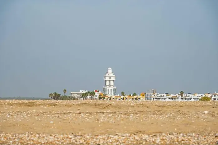 Framed Print : sand beach at Isla Cristina at the Costa de la Luz in Andalusia with view to town and lighthouse Framed Print : sand beach at Isla Cristina at the Costa de la Luz in Andalusia with view to town and lighthouse