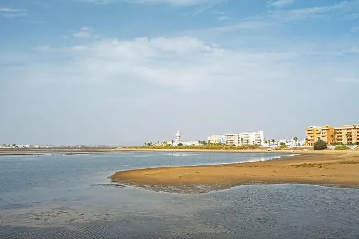 Framed Print : sand beach at Isla Cristina at the Costa de la Luz in Andalusia with view to town and lighthouse Framed Print : sand beach at Isla Cristina at the Costa de la Luz in Andalusia with view to town and lighthouse