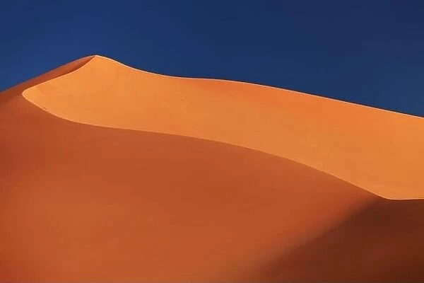 Sand dune in Sahara Desert at sunset, Algeria