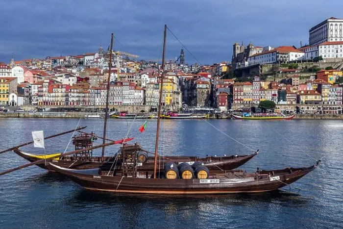 Framed Print : Sandeman and Porto Cruz Port wine boats called Rabelo Boats on a Douro River in Vila Nova de Gaia city Framed Print : Sandeman and Porto Cruz Port wine boats called Rabelo Boats on a Douro River in Vila Nova de Gaia city