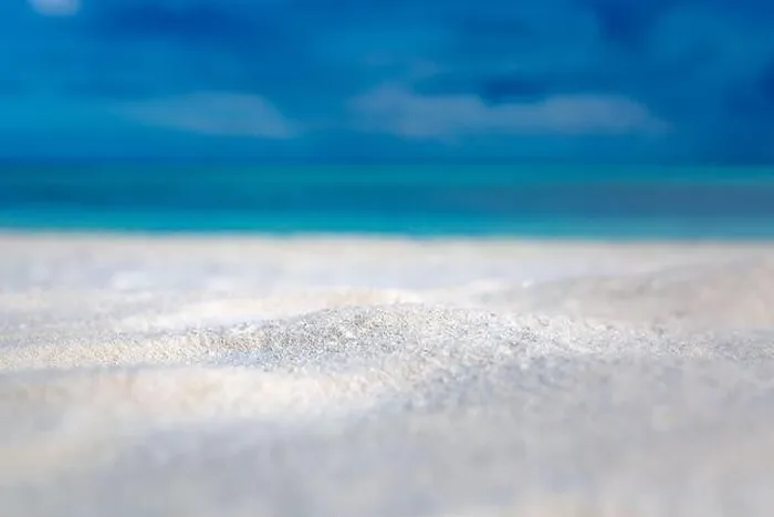 Framed Print : Sandy beach and beautiful tropical sea on blue sky background. Summer sand beach background. Sea and sky. Summer concept Framed Print : Sandy beach and beautiful tropical sea on blue sky background. Summer sand beach background. Sea and sky. Summer concept