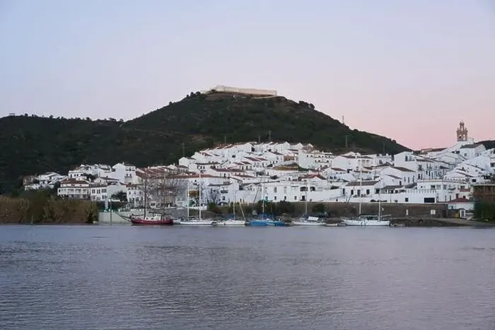 Framed Print : Sanlucar de Guadiana in Spain and Alcoutim in Portugal with sail boats on Guadiana river