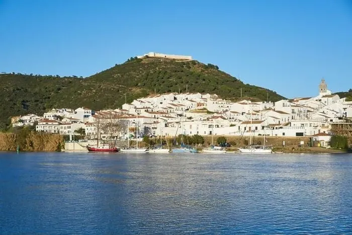 Framed Print : Sanlucar de Guadiana in Spain and Alcoutim in Portugal with sail boats on Guadiana river Framed Print : Sanlucar de Guadiana in Spain and Alcoutim in Portugal with sail boats on Guadiana river