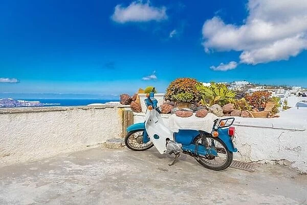 Santorini caldera view with old scooter, white architecture and traditional travel landscape