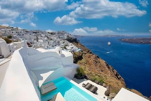 Santorini, Greece landscape, pool caldera view with flowers blue doors. Romantic couple destination with sunny sky, wonderful summer travel hotel