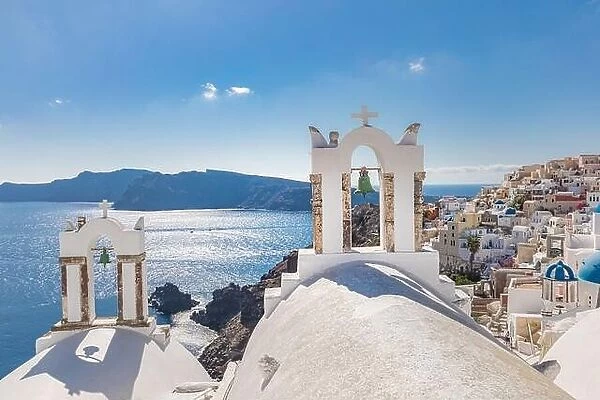 Santorini, Greece. Picturesque sea view of traditional cycladic Santorini houses on small street with flowers in foreground. Amazing travel landscape