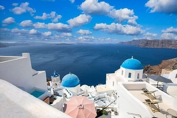 Santorini island, Greece. Incredibly panoramic romantic summer landscape on Santorini. Oia village in the morning light. Amazing view with white house