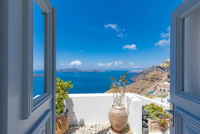 Framed Print : Santorini Island, Greece. Traditional Greek door with a great view. Amazing seascape over cliff with wooden door and traditional white architecture Framed Print : Santorini Island, Greece. Traditional Greek door with a great view. Amazing seascape over cliff with wooden door and traditional white architecture