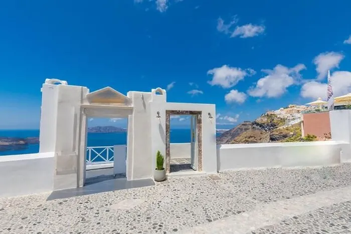 Framed Print : Santorini Island, Greece. Traditional Greek door with a great view. Amazing seascape over cliff with wooden door and traditional white architecture Framed Print : Santorini Island, Greece. Traditional Greek door with a great view. Amazing seascape over cliff with wooden door and traditional white architecture
