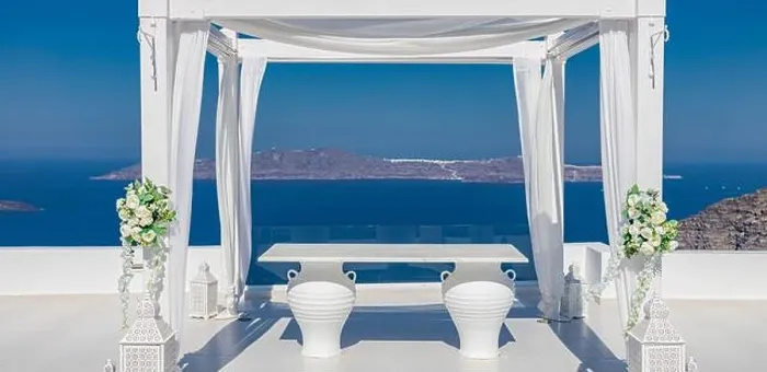 Framed Print : Santorini Island, Greece. Wedding decoration on a popular couple destination. Elegant wedding arch with white flowers, vases on background of blue sea Framed Print : Santorini Island, Greece. Wedding decoration on a popular couple destination. Elegant wedding arch with white flowers, vases on background of blue sea