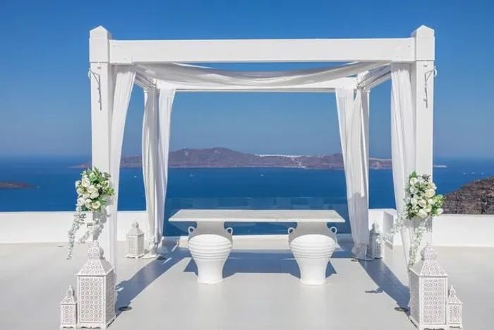 Framed Print : Santorini Island, Greece. Wedding decoration on a popular couple destination. Elegant wedding arch with white flowers, vases on background of blue sea Framed Print : Santorini Island, Greece. Wedding decoration on a popular couple destination. Elegant wedding arch with white flowers, vases on background of blue sea