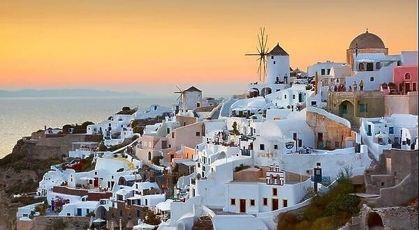 Santorini - view of Oia Town and windmills at sunset time, Greece