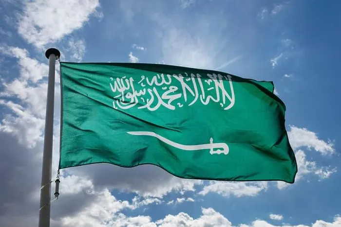 Framed Print : Saudi Arabia flag, Kingdom of Saudi Arabia national symbol on a flagpole waving against blue cloudy sky Framed Print : Saudi Arabia flag, Kingdom of Saudi Arabia national symbol on a flagpole waving against blue cloudy sky