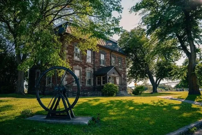 Framed Print : Sault Ste. Marie, ON, Canada-June 30, 2022 Historical building on the waterfront of the Soo Locks.. High quality photo Framed Print : Sault Ste. Marie, ON, Canada-June 30, 2022 Historical building on the waterfront of the Soo Locks.. High quality photo