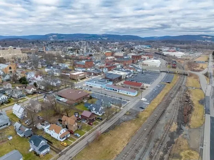 Framed Print : Sayre, PA, USA - 03-03-2024 - Cloudy winter aerial image of the downtown area in the City of Sayre, PA