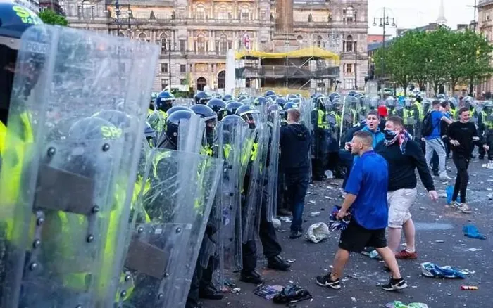 Framed Print : Scenes from George Square in Glasgow following Rangers 55th league title win with riot police attempting to clear fans Framed Print : Scenes from George Square in Glasgow following Rangers 55th league title win with riot police attempting to clear fans