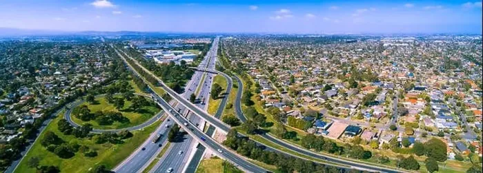 Framed Print : Scenic aerial panorama of highway interchange in greater Melbourne suburbs on sunny day Framed Print : Scenic aerial panorama of highway interchange in greater Melbourne suburbs on sunny day