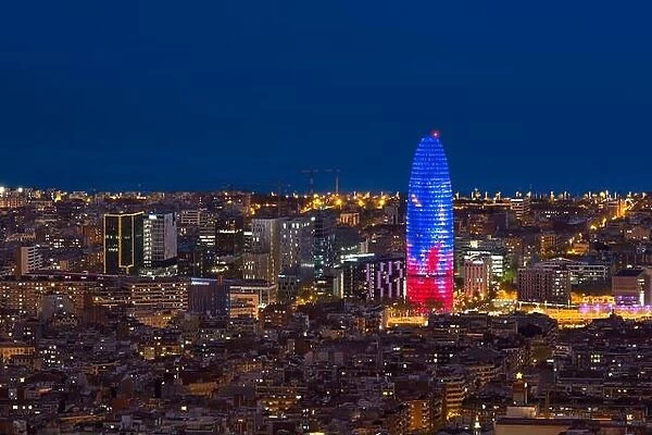 Scenic aerial view of Barcelona city skyscraper and skyline at night in Barcelona, Spain