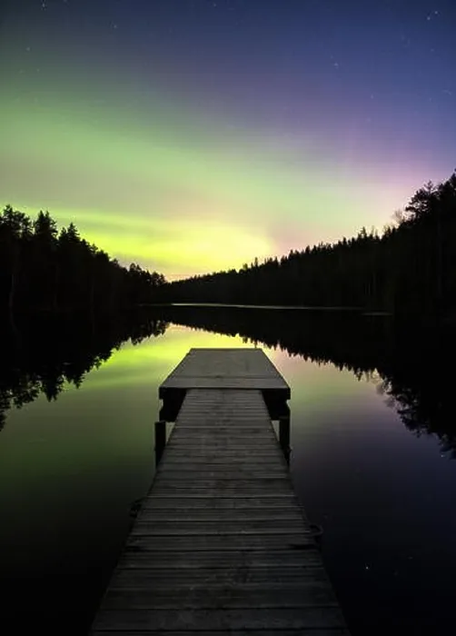 Framed Print : Scenic aurora borealis with nice reflections and pier at night in Finland Framed Print : Scenic aurora borealis with nice reflections and pier at night in Finland