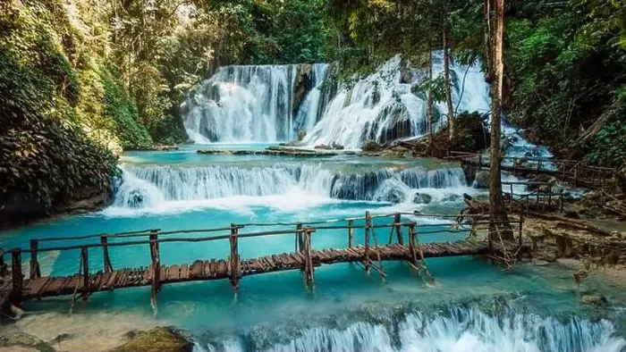 Framed Print : Scenic cascade waterfall with clear blue water and wooden bridge in Central Sulawesi, drone view Framed Print : Scenic cascade waterfall with clear blue water and wooden bridge in Central Sulawesi, drone view