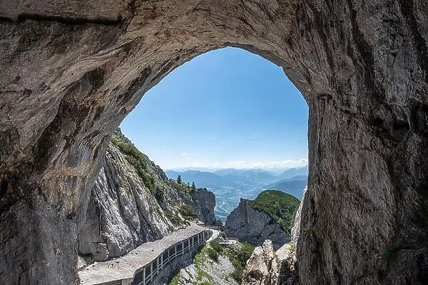Scenic cave landscape with mountains and blue sky at bright summer day in Werfen, Austria. Ice cave hole
