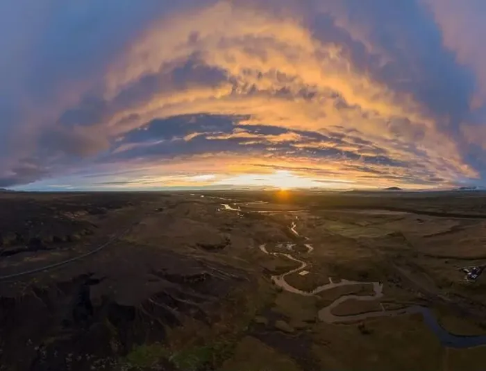 Framed Print : Scenic drone view of curvy river flowing in green valley against cloudy sundown sky in countryside of Iceland Framed Print : Scenic drone view of curvy river flowing in green valley against cloudy sundown sky in countryside of Iceland