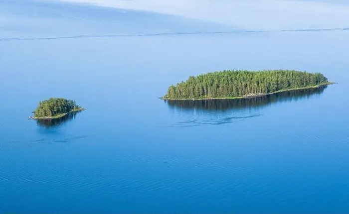 Framed Print : Scenic lake landscape with blue water and beautiful pine trees island at sunny summer day in National park Finland Framed Print : Scenic lake landscape with blue water and beautiful pine trees island at sunny summer day in National park Finland