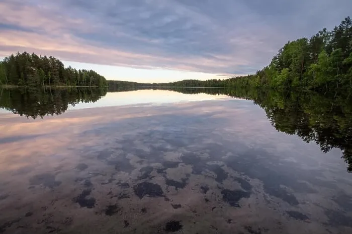 Framed Print : Scenic lake landscape with bright water and evening light at summer in Loppi, Finland Framed Print : Scenic lake landscape with bright water and evening light at summer in Loppi, Finland