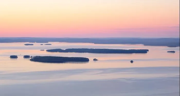 Framed Print : Scenic lake landscape with sunset and beautiful islands island at mood summer evening in National park Finland Framed Print : Scenic lake landscape with sunset and beautiful islands island at mood summer evening in National park Finland