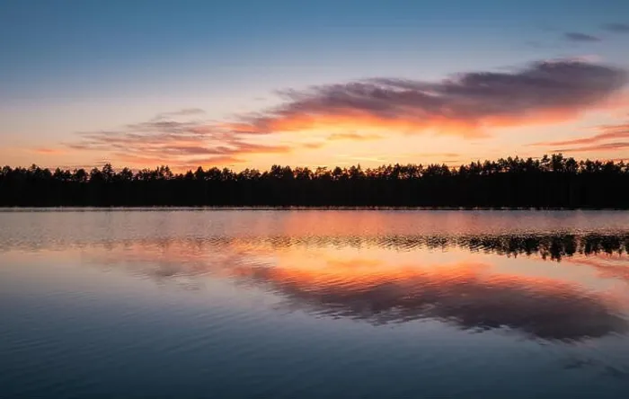 Framed Print : Scenic lake view with reflections and sunset at peaceful evening in National Park Finland Framed Print : Scenic lake view with reflections and sunset at peaceful evening in National Park Finland