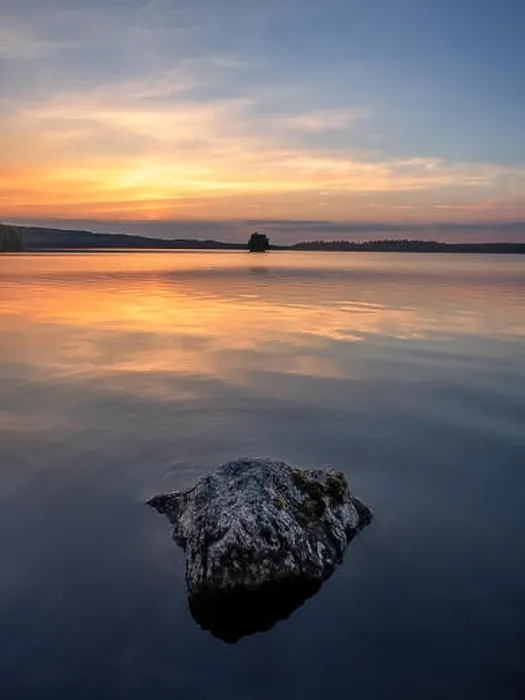 Framed Print : Scenic landscape with beautiful sunset and lake at summer evening in Finland