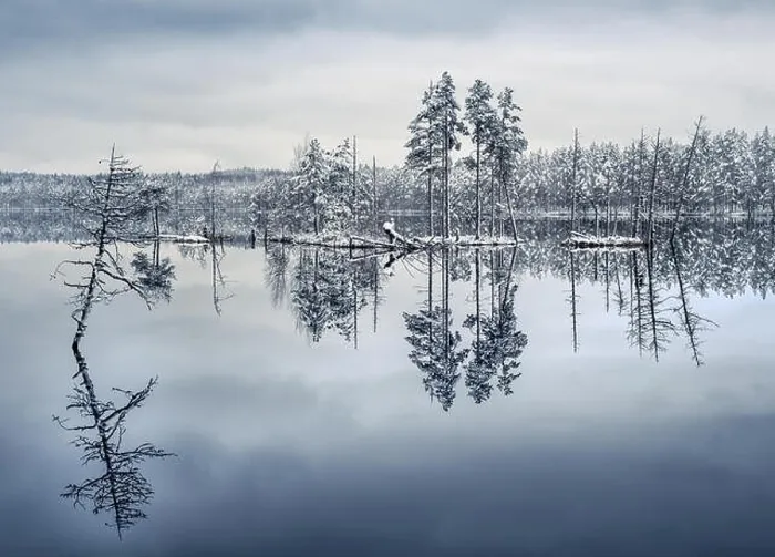 Framed Print : Scenic landscape with lake reflection and snow at winter evening Framed Print : Scenic landscape with lake reflection and snow at winter evening