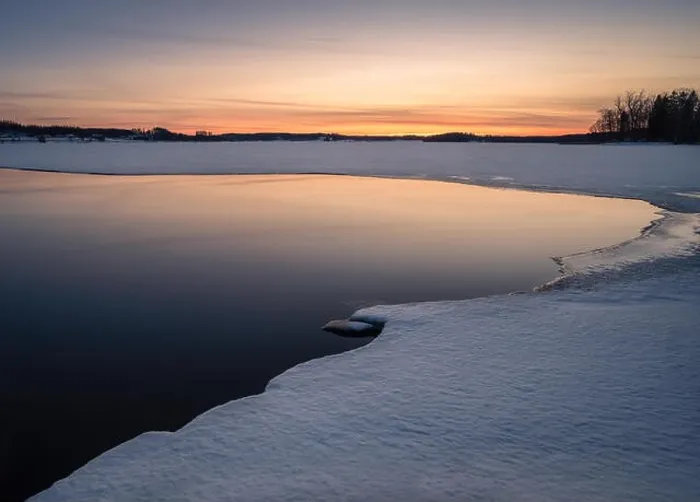Framed Print : Scenic landscape with melted lake an sunset at evening in Finland Framed Print : Scenic landscape with melted lake an sunset at evening in Finland