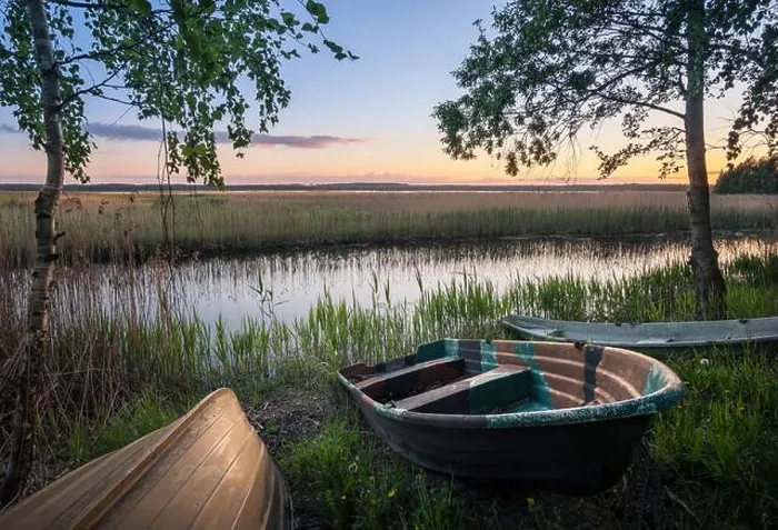 Framed Print : Scenic landscape with rowboats at peaceful summer evening in Hyvinkää, Finland Framed Print : Scenic landscape with rowboats at peaceful summer evening in Hyvinkää, Finland
