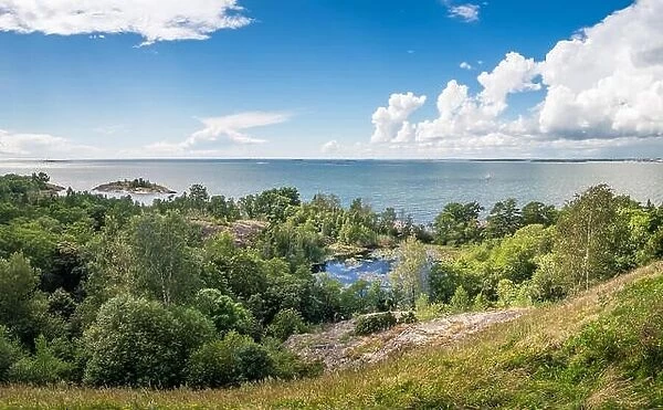 Scenic landscape with sea and lush foliage at bright summer day in Finland