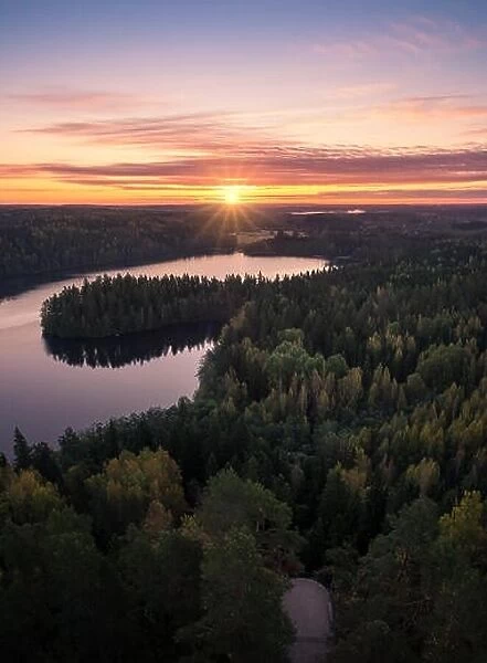 Scenic landscape with sunrise and lake at autumn in national park in Finland