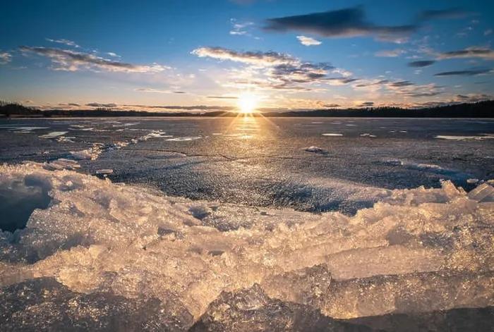 Framed Print : Scenic landscape with sunset and melting ice at beautiful evening in Finland Framed Print : Scenic landscape with sunset and melting ice at beautiful evening in Finland