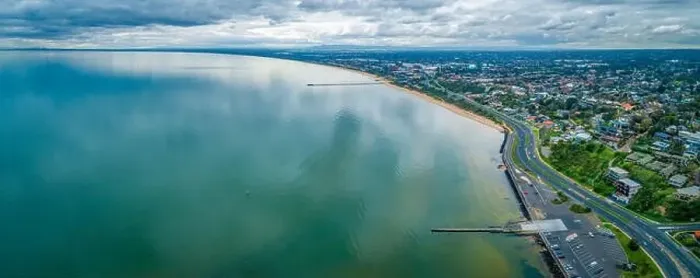 Framed Print : Scenic Mornington Peninsula coastline along Frankston suburb showing two piers on overcast day - aerial panoramic Framed Print : Scenic Mornington Peninsula coastline along Frankston suburb showing two piers on overcast day - aerial panoramic