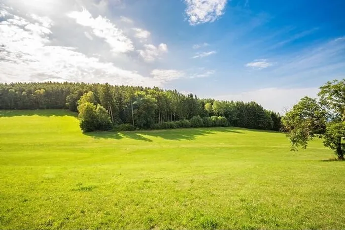 Framed Print : Scenic panoramic view of idyllic rolling hills landscape with blooming meadows and alpine mountain background. Green spring summer landscape Framed Print : Scenic panoramic view of idyllic rolling hills landscape with blooming meadows and alpine mountain background. Green spring summer landscape