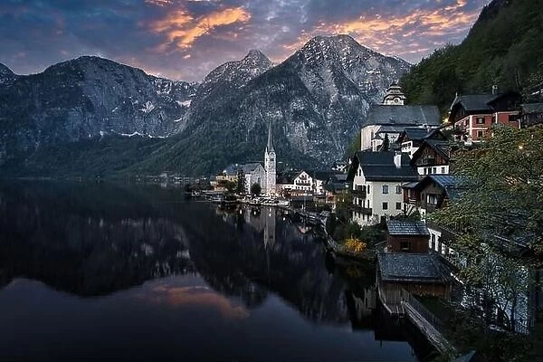 Scenic picture-postcard view of famous Hallstatt mountain village in the Austrian Alps at beautiful sunset light in spring, Salzkammergut region, Hall