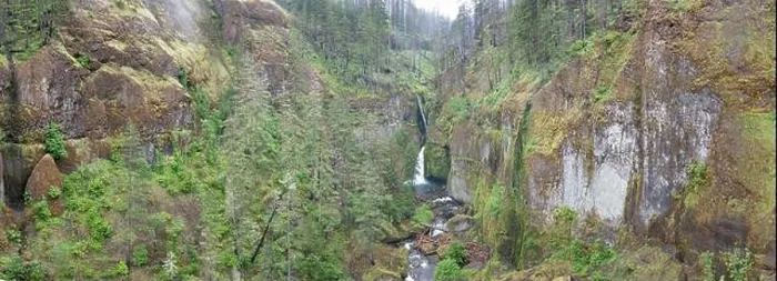 Framed Print : A scenic river flows over a waterfall and into the Columbia River Gorge, Oregon. This beautiful area is known for its waterfalls and forests