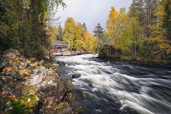 Scenic river landscape with beautiful fall colors at autumn day in National park, Finland