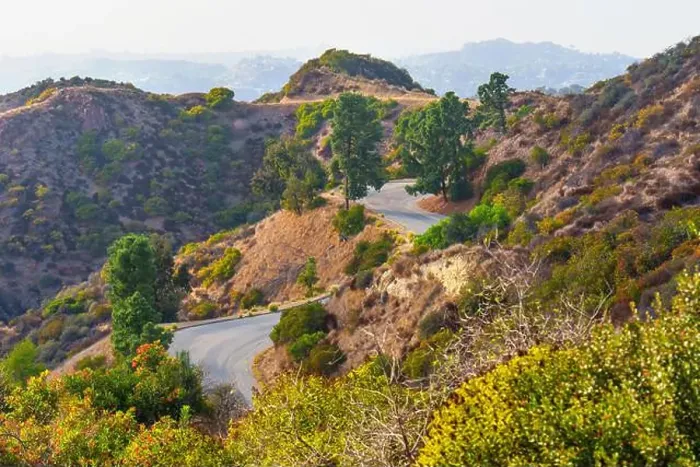 Framed Print : Scenic road winding through Mount Hollywood with surrounding greenery and hills Framed Print : Scenic road winding through Mount Hollywood with surrounding greenery and hills