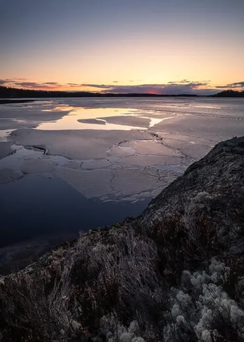 Framed Print : Scenic spring landscape with melted ice and sunset at evening light in Finland Framed Print : Scenic spring landscape with melted ice and sunset at evening light in Finland