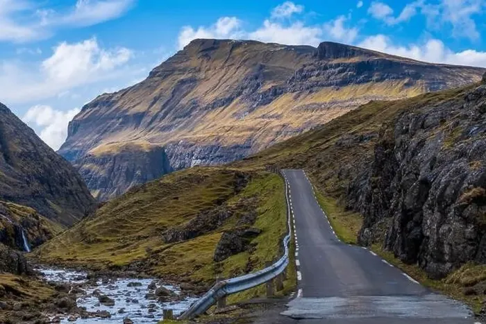 Framed Print : A scenic empty straight uphill road leading to Saksun, in Faroe Islands Framed Print : A scenic empty straight uphill road leading to Saksun, in Faroe Islands