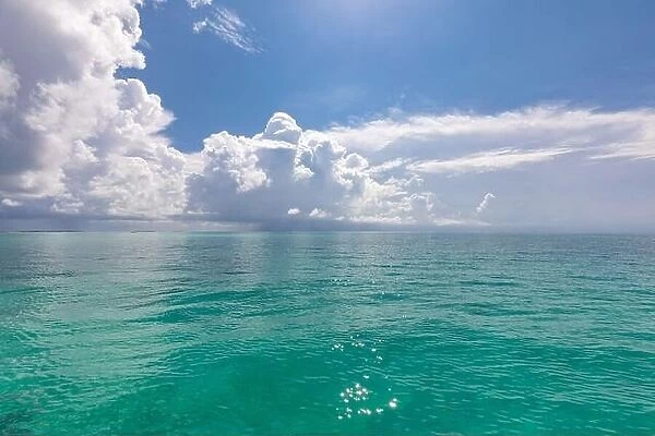 Scenic summer view of the blue tropical sea or ocean resort and sky with clouds. Beautiful ocean beach