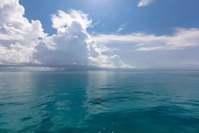 Framed Print : Scenic summer view of the blue tropical sea or ocean resort and sky with clouds. Beautiful ocean beach Framed Print : Scenic summer view of the blue tropical sea or ocean resort and sky with clouds. Beautiful ocean beach