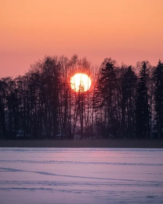 Framed Print : Scenic sunset with big sun at winter evening in Finland Framed Print : Scenic sunset with big sun at winter evening in Finland