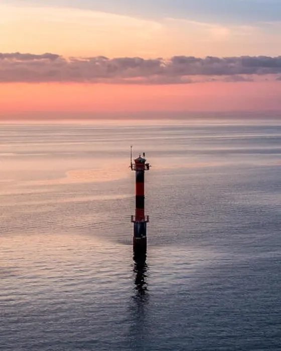 Framed Print : Scenic sunset landscape with sea and lighthouse at evening in Finland Framed Print : Scenic sunset landscape with sea and lighthouse at evening in Finland