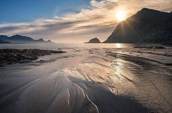 Scenic view from Haukland beach, Lofoten, Norway at summer evening with sunset